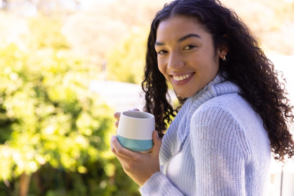 woman holding smart mug